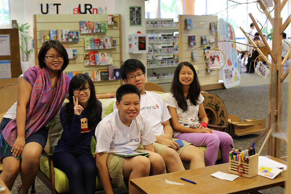 Relaxing at the Bukit Merah Library after a day of going door to door. Volunteers from right - Joshua & Gracie. Photo SG Snaps