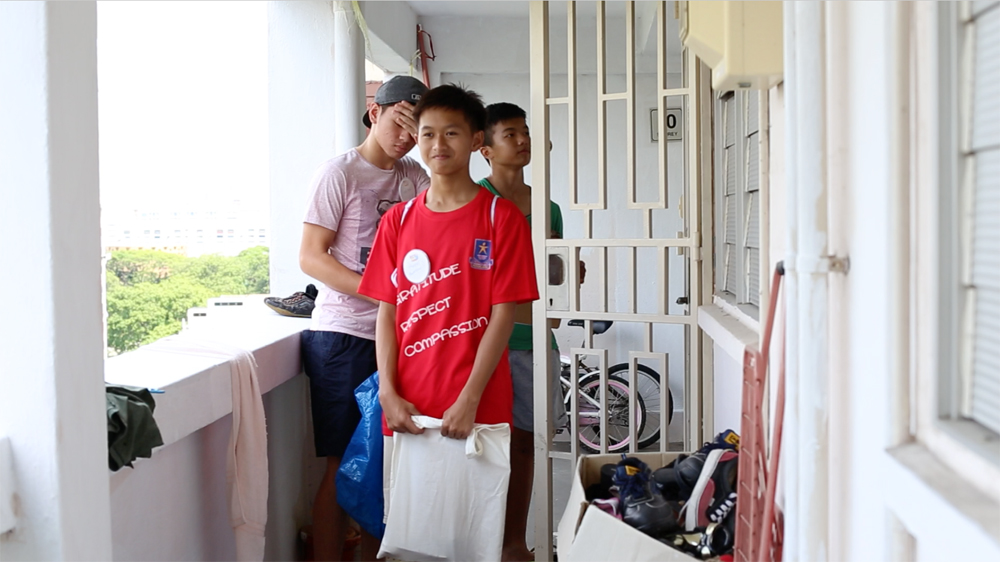No hard feelings; volunteers (from front), Hairul, Sean & Zhi Hong turning around after being rejected by a resident. Photo: SG Snaps
